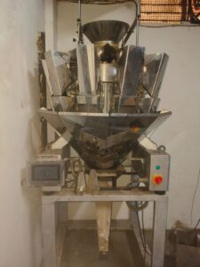 10 head Weigher, Conveyor & band sealer
